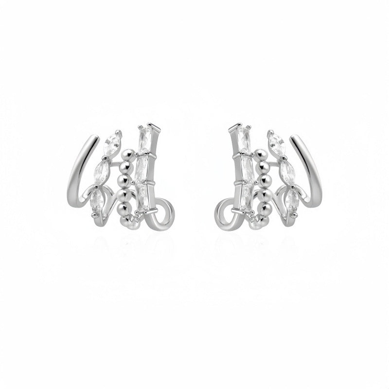 Diamond Accented Claw Stud Earrings in silver