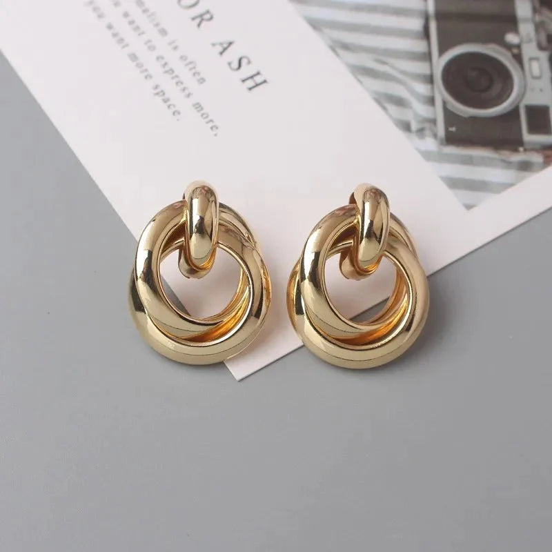 Circular Geometric Interwoven Earrings in gold