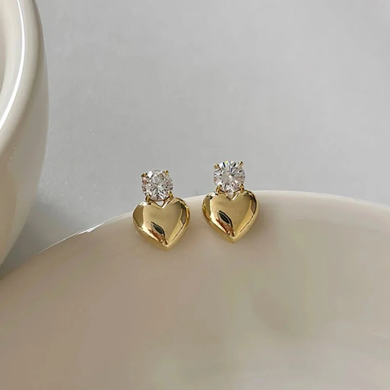 Dainty Diamond Heart Stud Earrings in gold