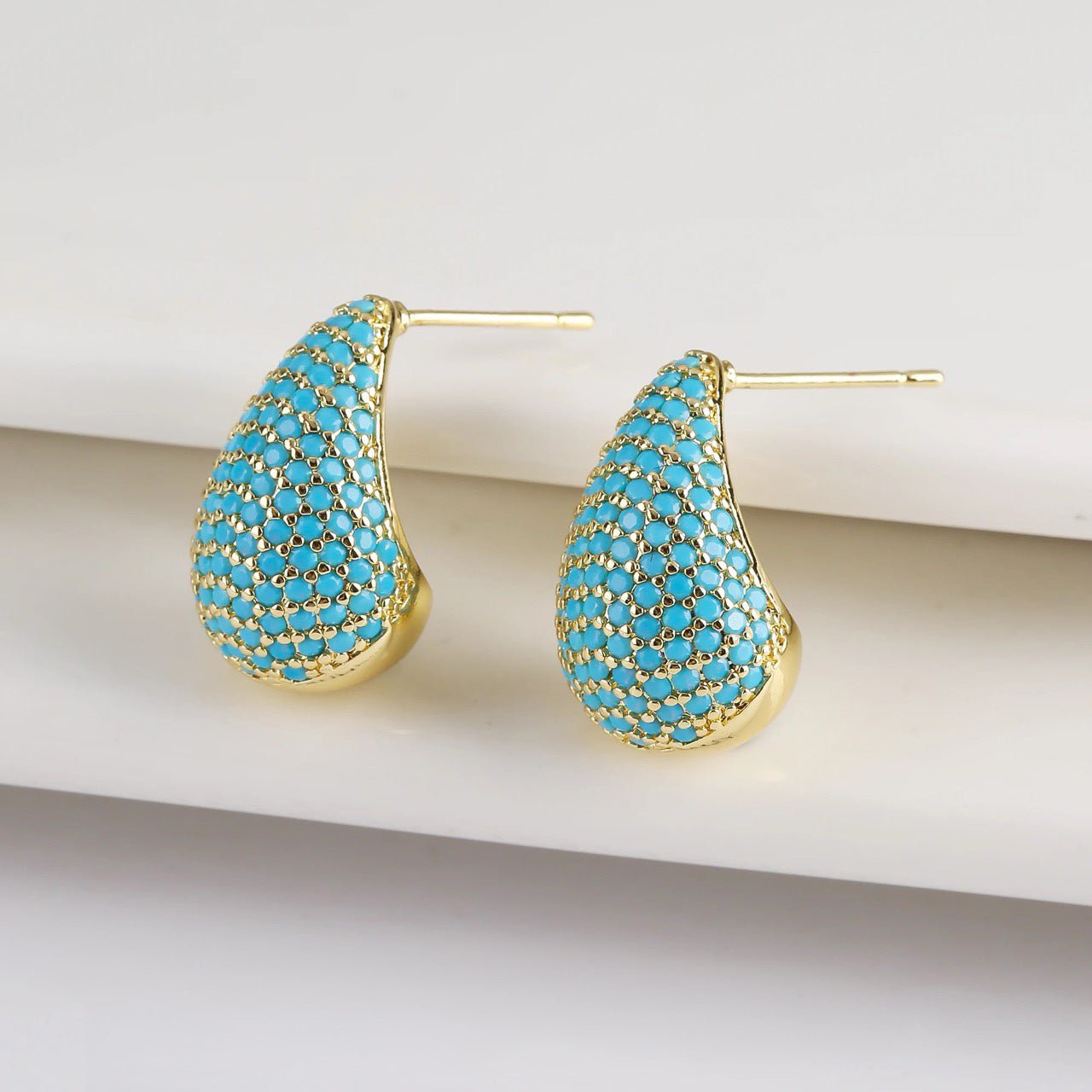 Dainty Glimmering Diamond Teardrop Earrings in blue