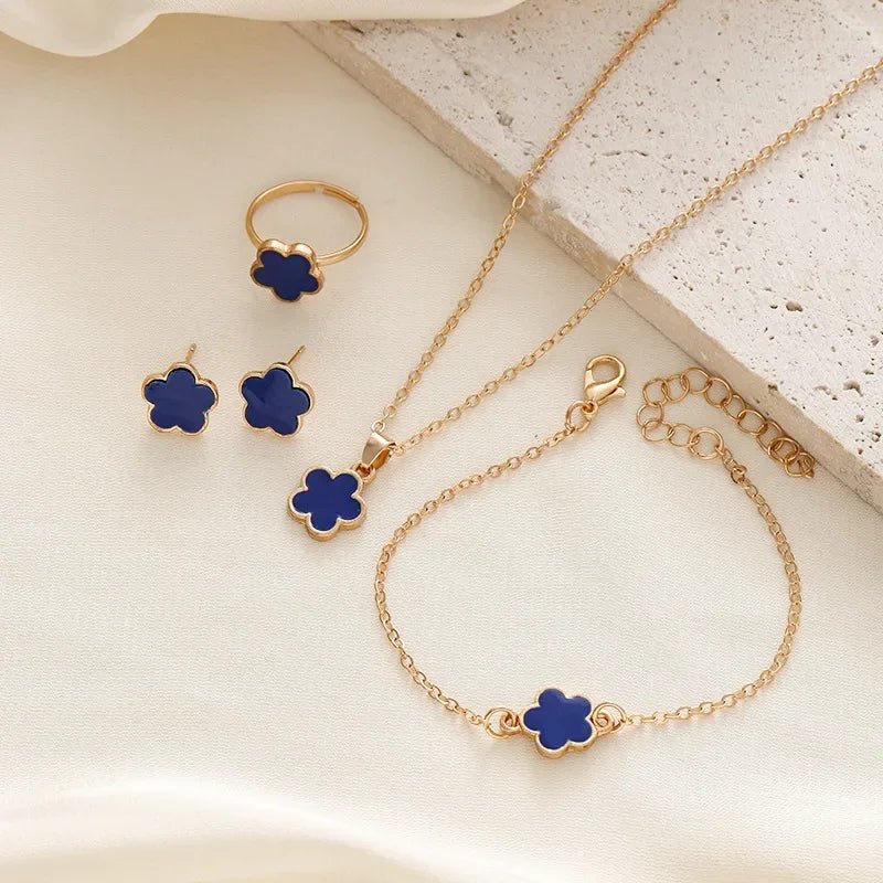 Dainty Lucky Floral Clover Necklace, Bracelet, Earrings, and Rings Set in blue