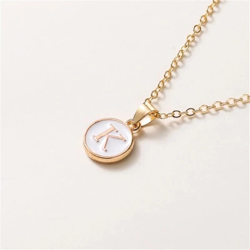 gold accented circle letter initial necklace