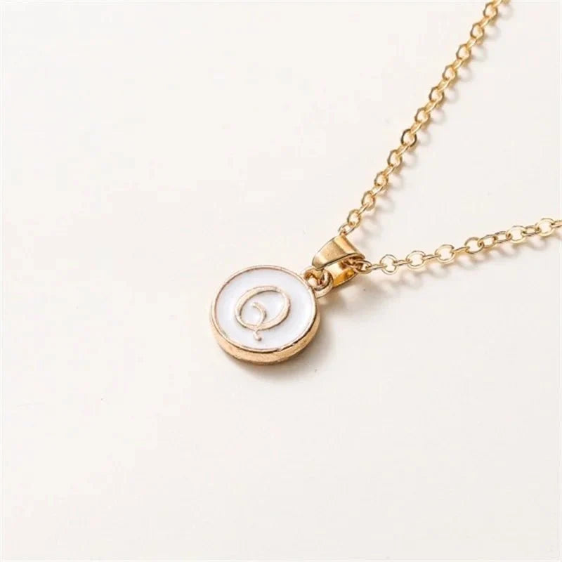 gold accented circle letter initial necklace
