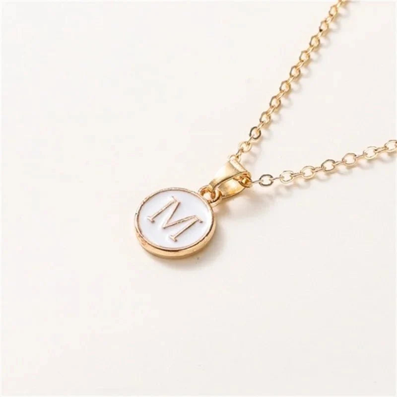 gold accented circle letter initial necklace