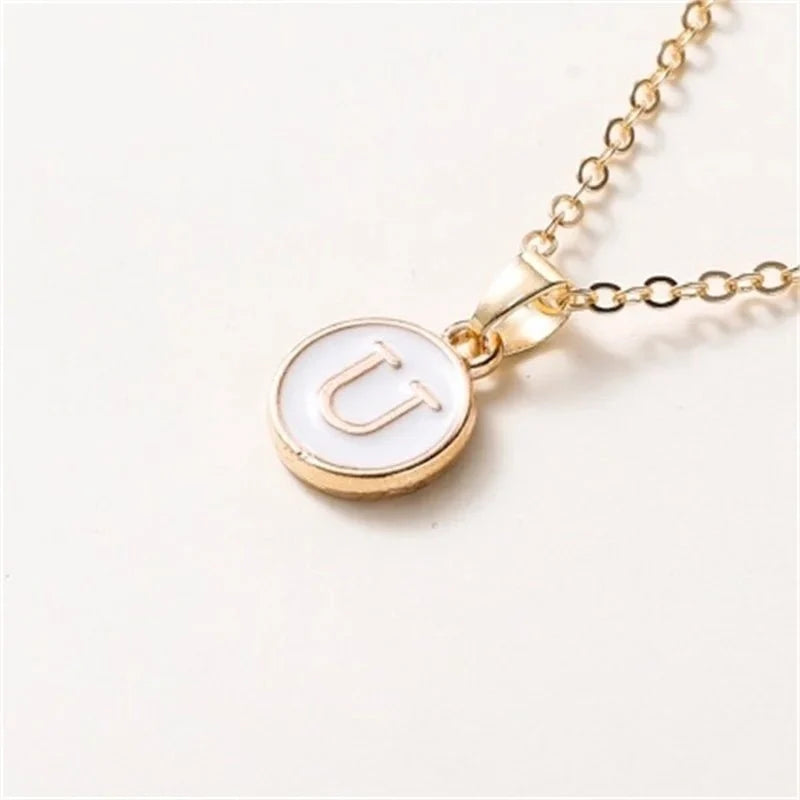 gold accented circle letter initial necklace