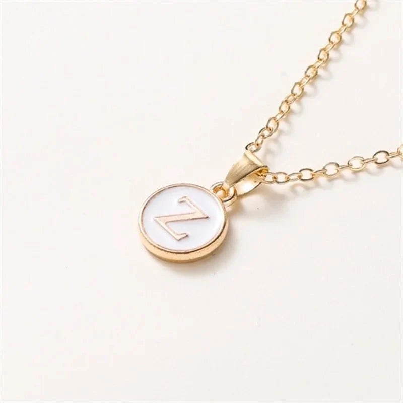 gold accented circle letter initial necklace