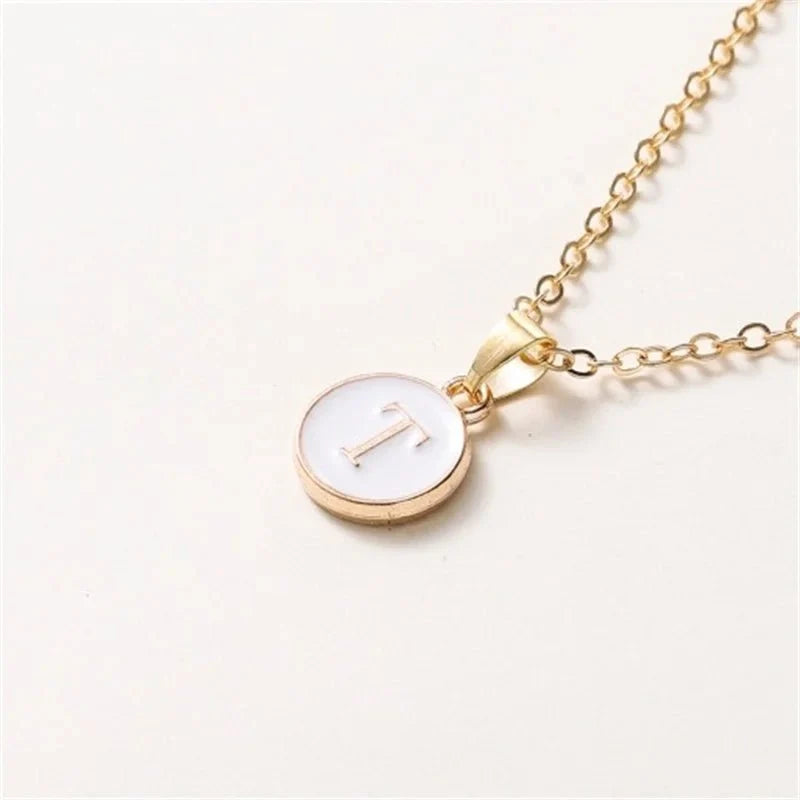 gold accented circle letter initial necklace