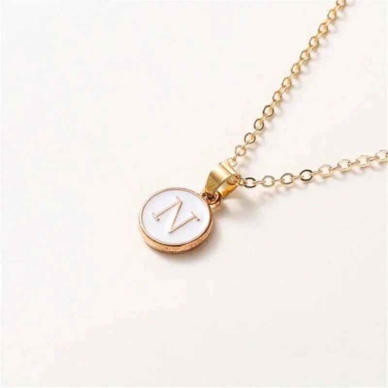 gold accented circle letter initial necklace