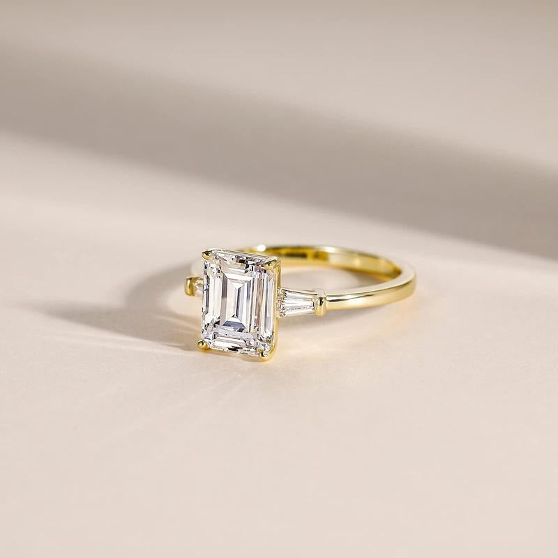 Emerald Cut Diamond Accented Ring in gold