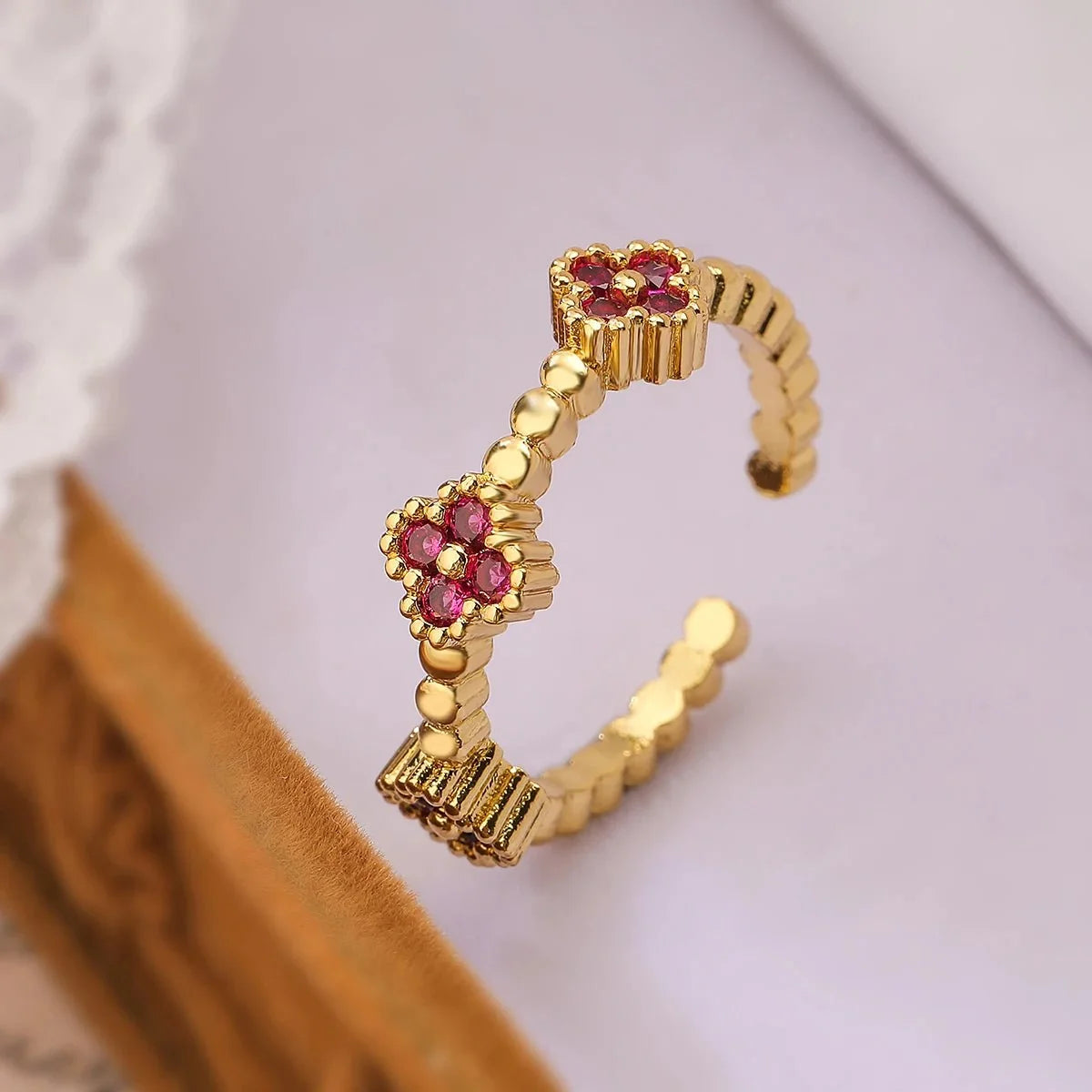Resizable Trio Textured Floral Rings in pink