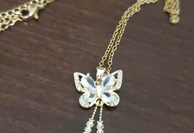 Charming Butterfly Diamond Dazzle Necklace worn by a customer