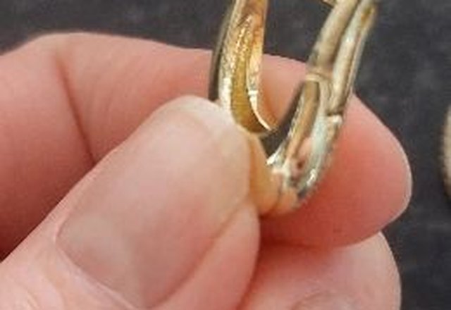 Chunky Glittering Diamond Hoop Earrings worn by a customer