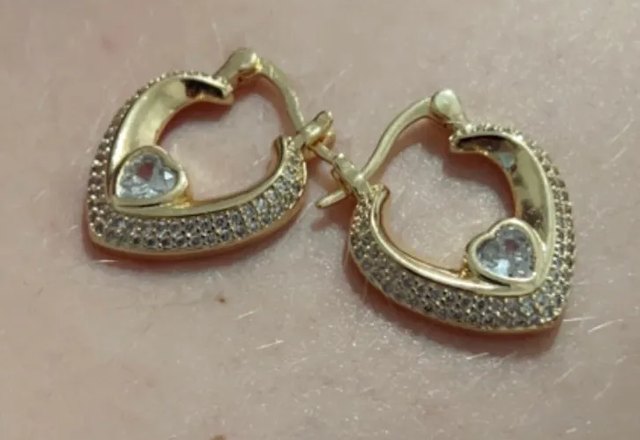 Glamorous Diamond Heart Earrings worn by a customer