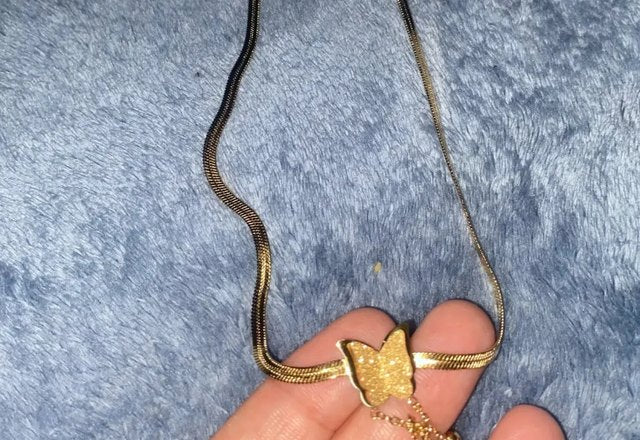 Dainty Herringbone Butterfly Dangle Necklace worn by a customer