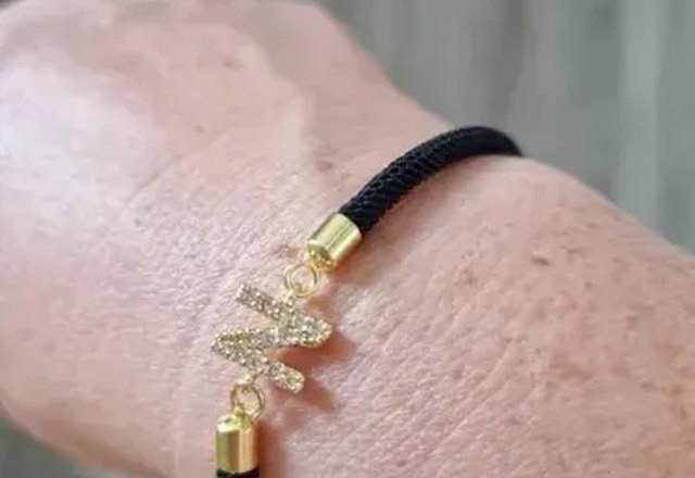 Adjustable Letter Initial Bracelets worn by a customer