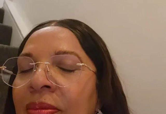 Dainty Statement Pearl Hoop Earrings worn by a customer