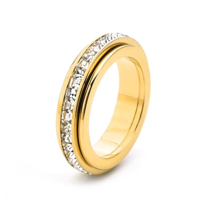 Simulated Diamond Accented Rotating Anxiety Relief Ring in gold