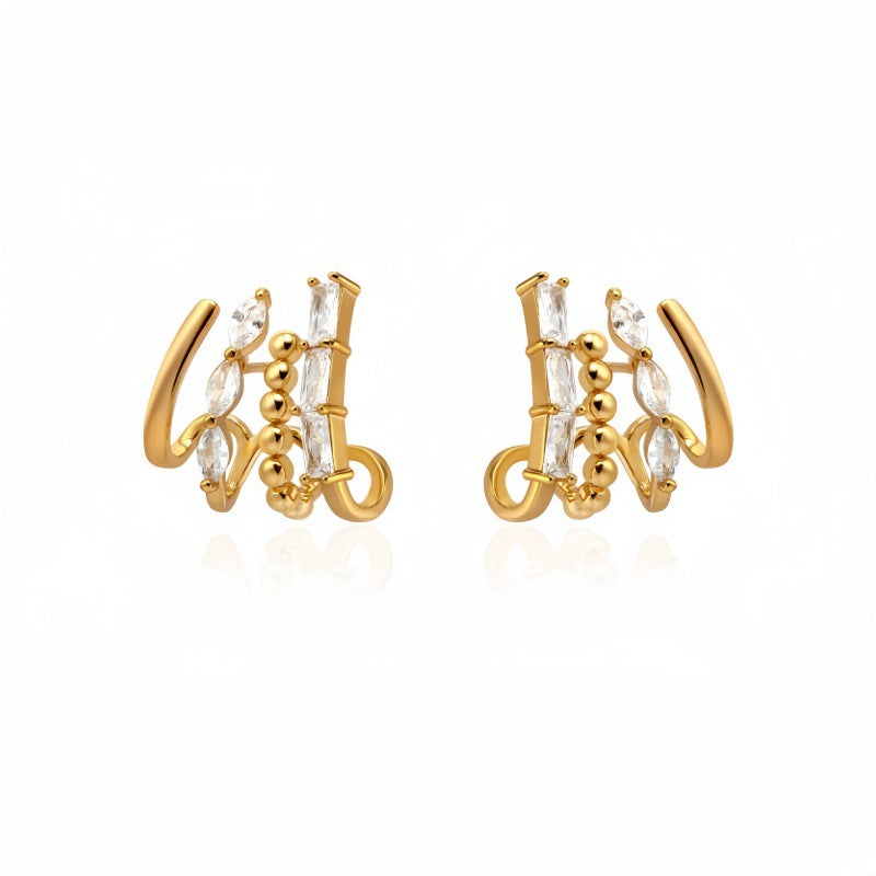 Diamond Accented Claw Stud Earrings in gold