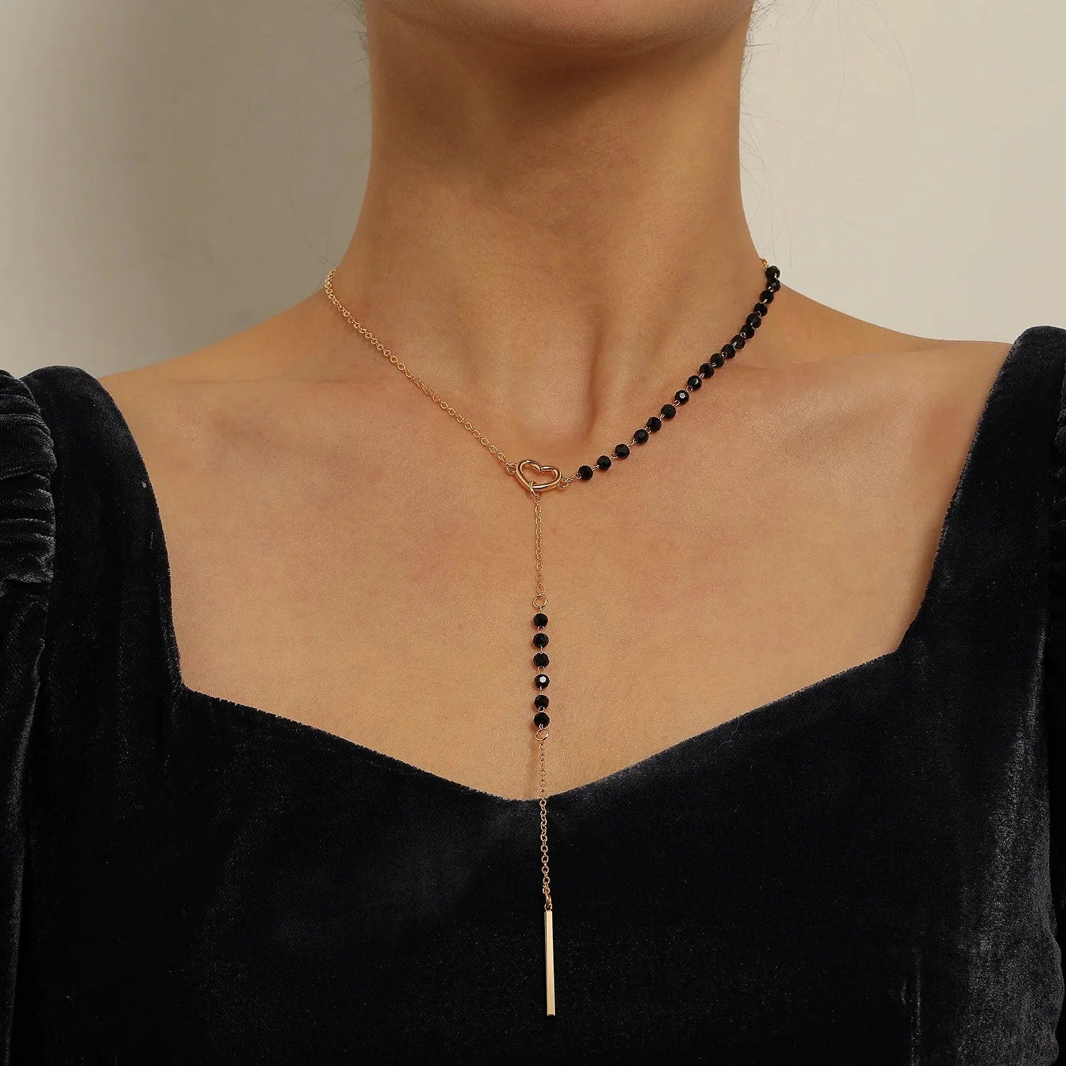 Dainty Heart Black and Gold Lariat Necklace in gold