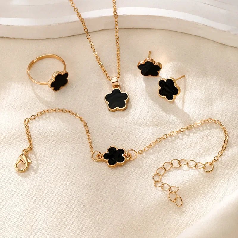 Dainty Lucky Floral Clover Necklace, Bracelet, Earrings, and Rings Set in black