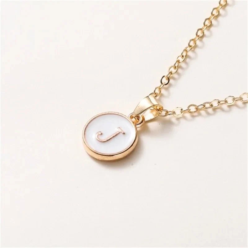 gold accented circle letter initial necklace