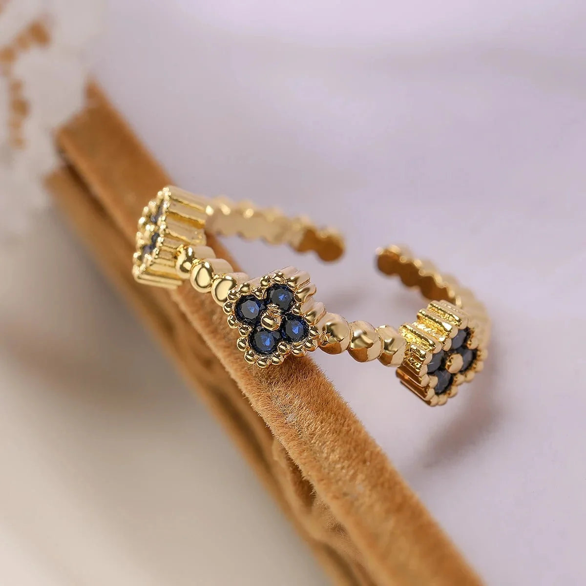 Resizable Trio Textured Floral Rings in blue