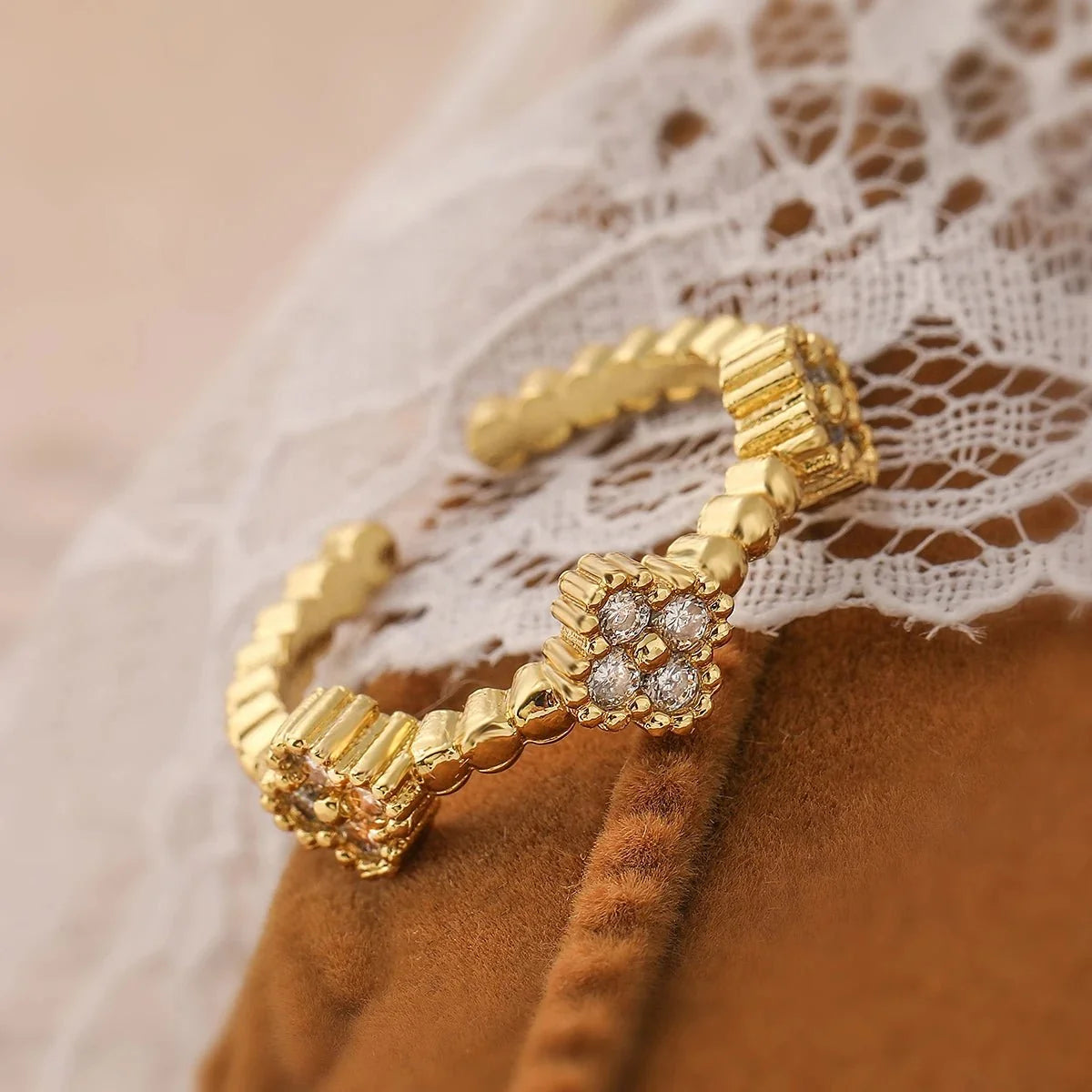 Resizable Trio Textured Floral Rings in white