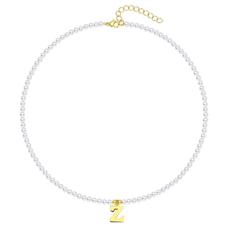 elegant gold accented pearl letter initial necklace