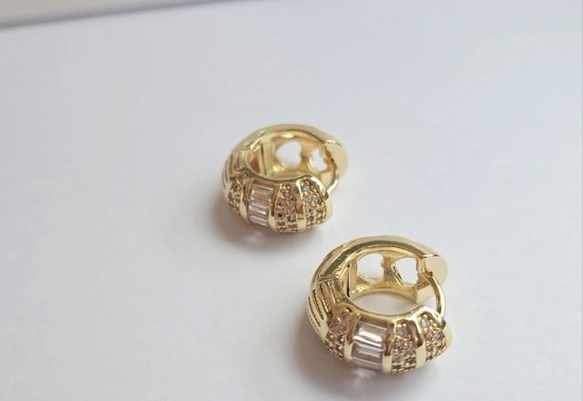 Bold Baguette Scattered Diamond Hoop Earrings worn by a customer