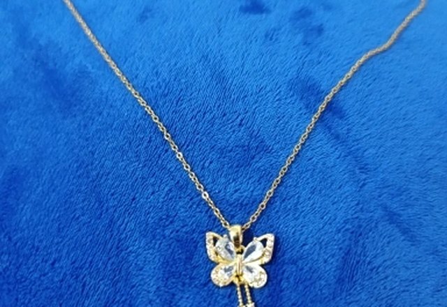 Charming Butterfly Diamond Dazzle Necklace worn by a customer