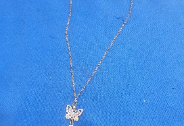 Charming Butterfly Diamond Dazzle Necklace worn by a customer