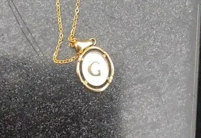 Accented Initial Chain Charm Necklace worn by a customer