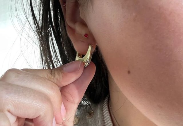 Chunky Glittering Diamond Hoop Earrings worn by a customer