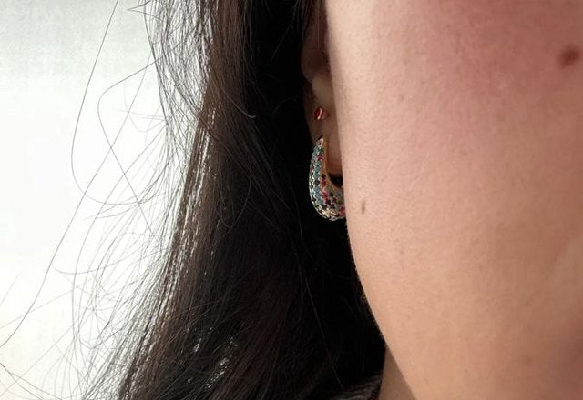 Chunky Glittering Diamond Hoop Earrings worn by a customer