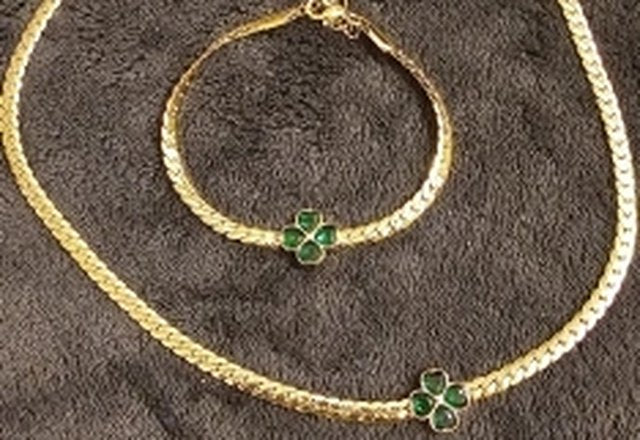 Emerald Four Leaf Clover Necklace, Bracelet, and Earring Set worn by a customer