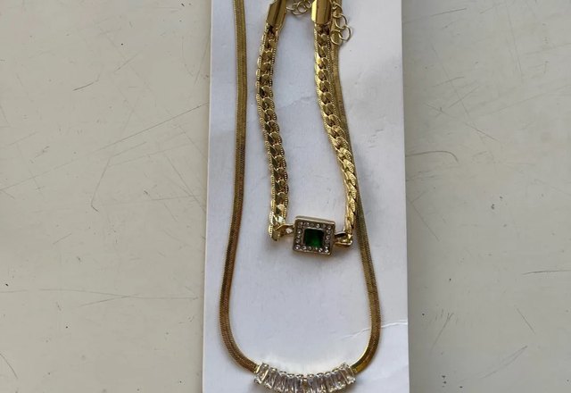 Emerald Four Leaf Clover Necklace, Bracelet, and Earring Set worn by a customer