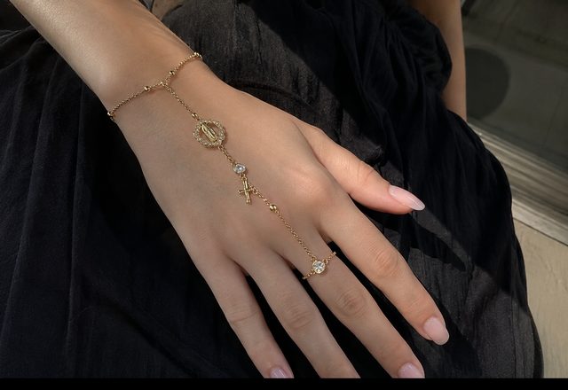 14k Virgin Mary & Jesus Christ Heart Cross Hand Chain worn by a customer