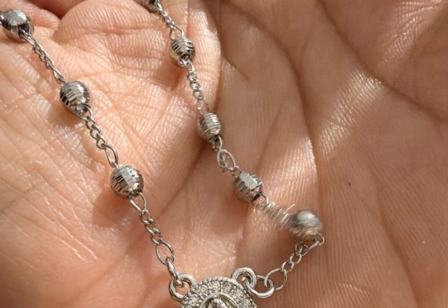 14k Virgin Mary & Jesus Christ Heart Cross Hand Chain worn by a customer