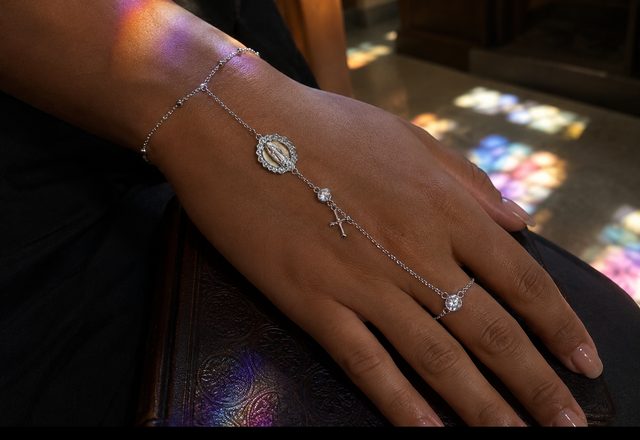 14k Virgin Mary & Jesus Christ Heart Cross Hand Chain worn by a customer