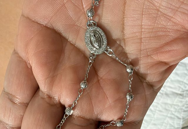 14k Virgin Mary & Jesus Christ Heart Cross Hand Chain worn by a customer