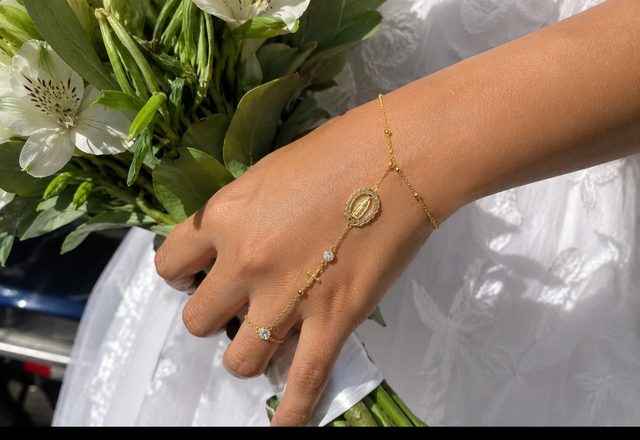 14k Virgin Mary & Jesus Christ Heart Cross Hand Chain worn by a customer