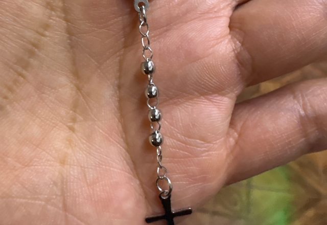 14k Virgin Mary & Jesus Christ Heart Cross Hand Chain worn by a customer