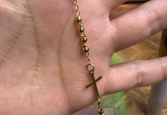 14k Virgin Mary & Jesus Christ Heart Cross Hand Chain worn by a customer