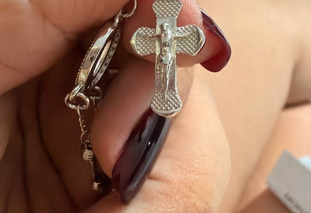 14k Virgin Mary & Jesus Christ Heart Cross Hand Chain worn by a customer