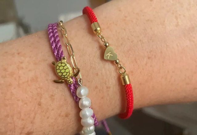 Adjustable Heart Letter Initial Bracelets worn by a customer