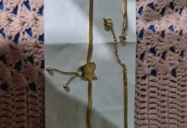 Dainty Herringbone Butterfly Dangle Necklace worn by a customer