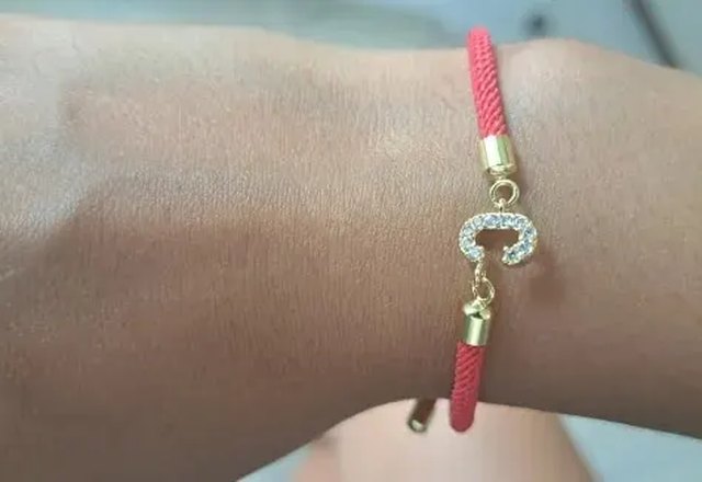 Adjustable Letter Initial Bracelets worn by a customer