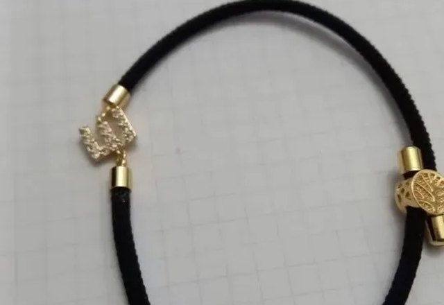 Adjustable Letter Initial Bracelets worn by a customer