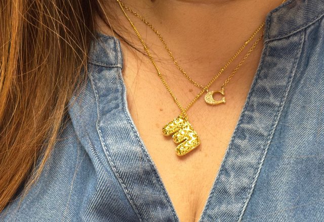 2pc Initial Necklaces worn by a customer